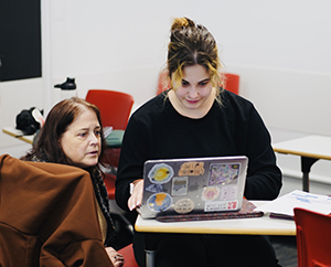 professor Bridget Freisthler and undergraduate Ciera Feucht review data